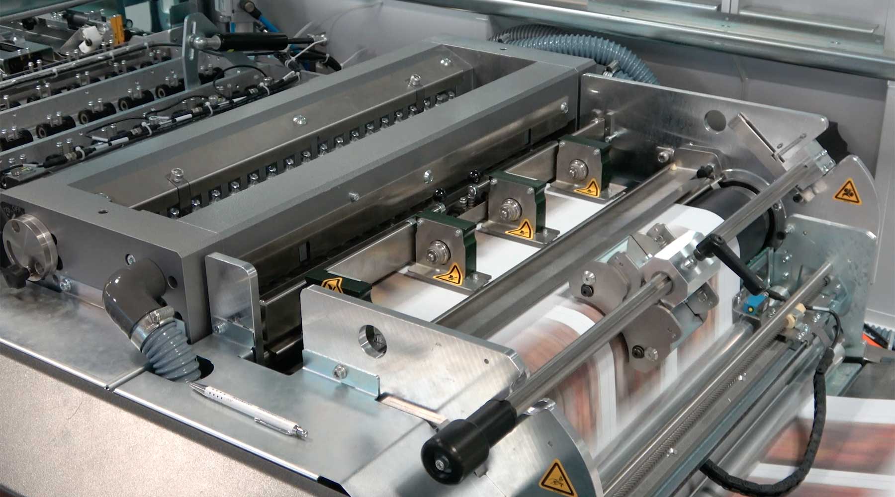 Roll to stack solution inline - Hunkeler