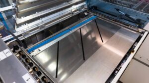 Vacuum belt transport in DMP.